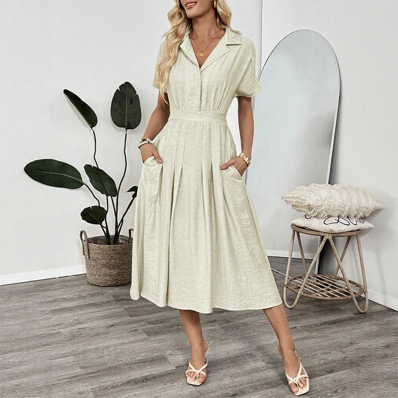 Light green women's shirt dress with lapel collar, defined waist, and pockets on a model.