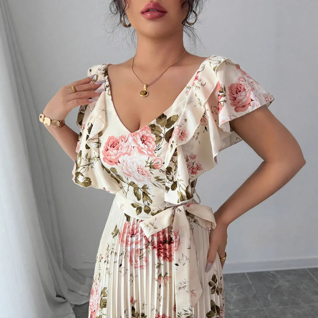 Apricot floral print V-neck dress with ruffled short sleeves and a long, flowing swing skirt.