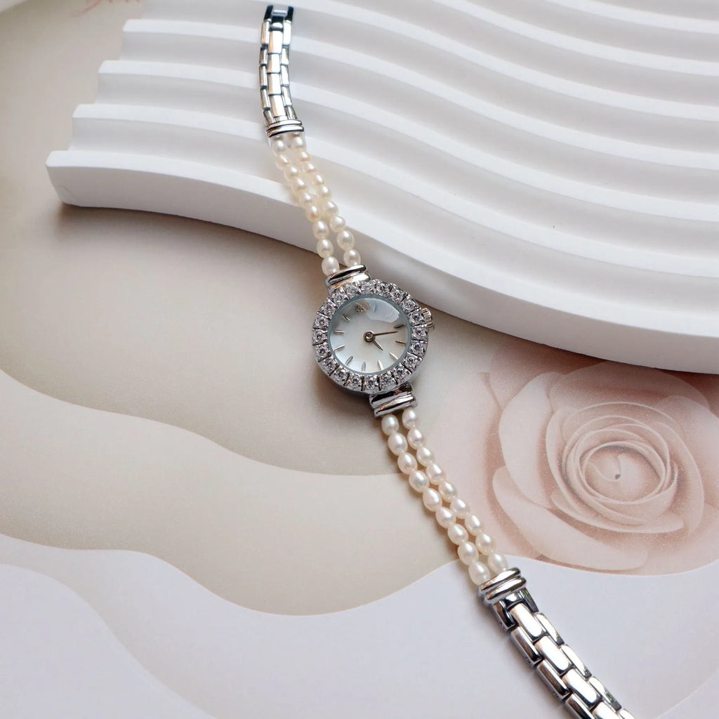 Women's light gold bracelet watch with freshwater pearls and 18mm mineral glass dial