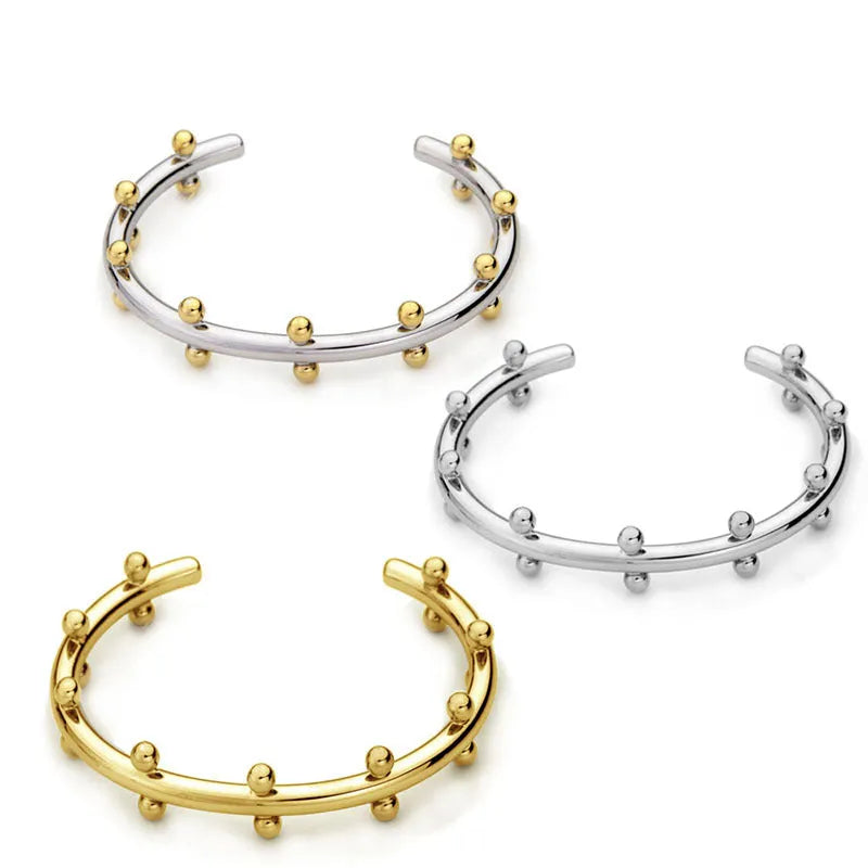 Stainless steel C-shaped bean beads with rivet texture in steel, gold and steel gold colours