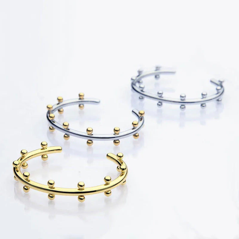 Stainless steel C-shaped bean beads with rivet texture in steel, gold and steel gold colours