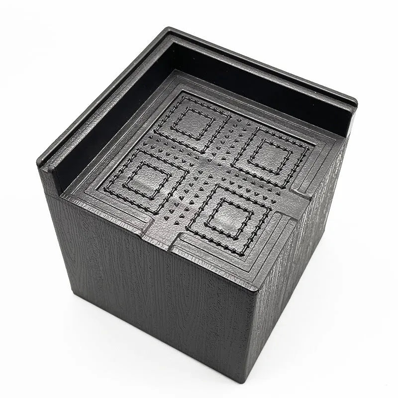 Four black plastic furniture foot mats for height adjustment of bed and sofa legs