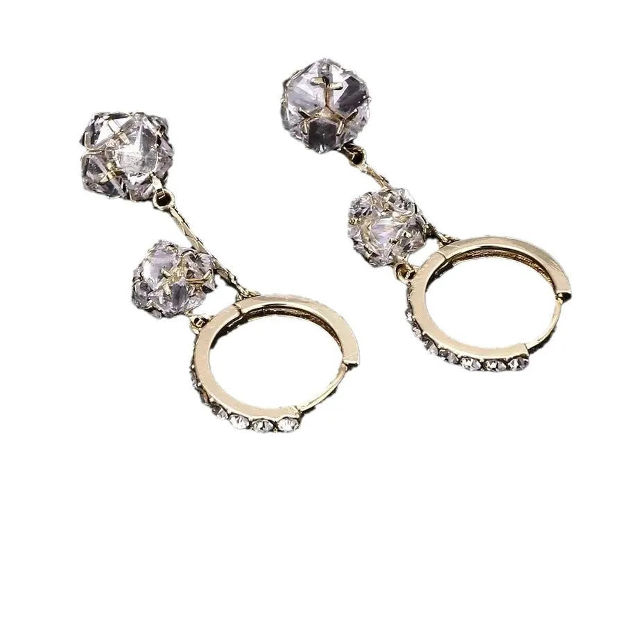 Silver colour women's earrings with tassel ball and rhinestone accents featuring confession balloon motif
