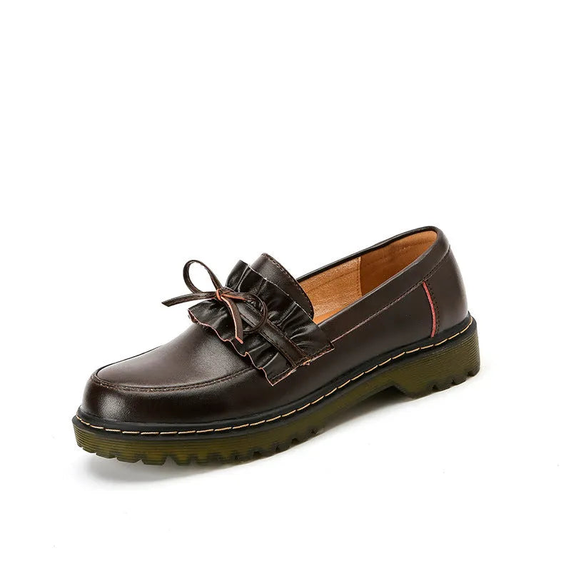 Black British style women's leather shoes with round toe and chunky flat heel on a white background.