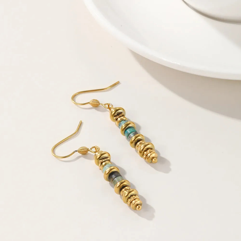Gold geometric titanium steel dangle earrings with a retro design for women.