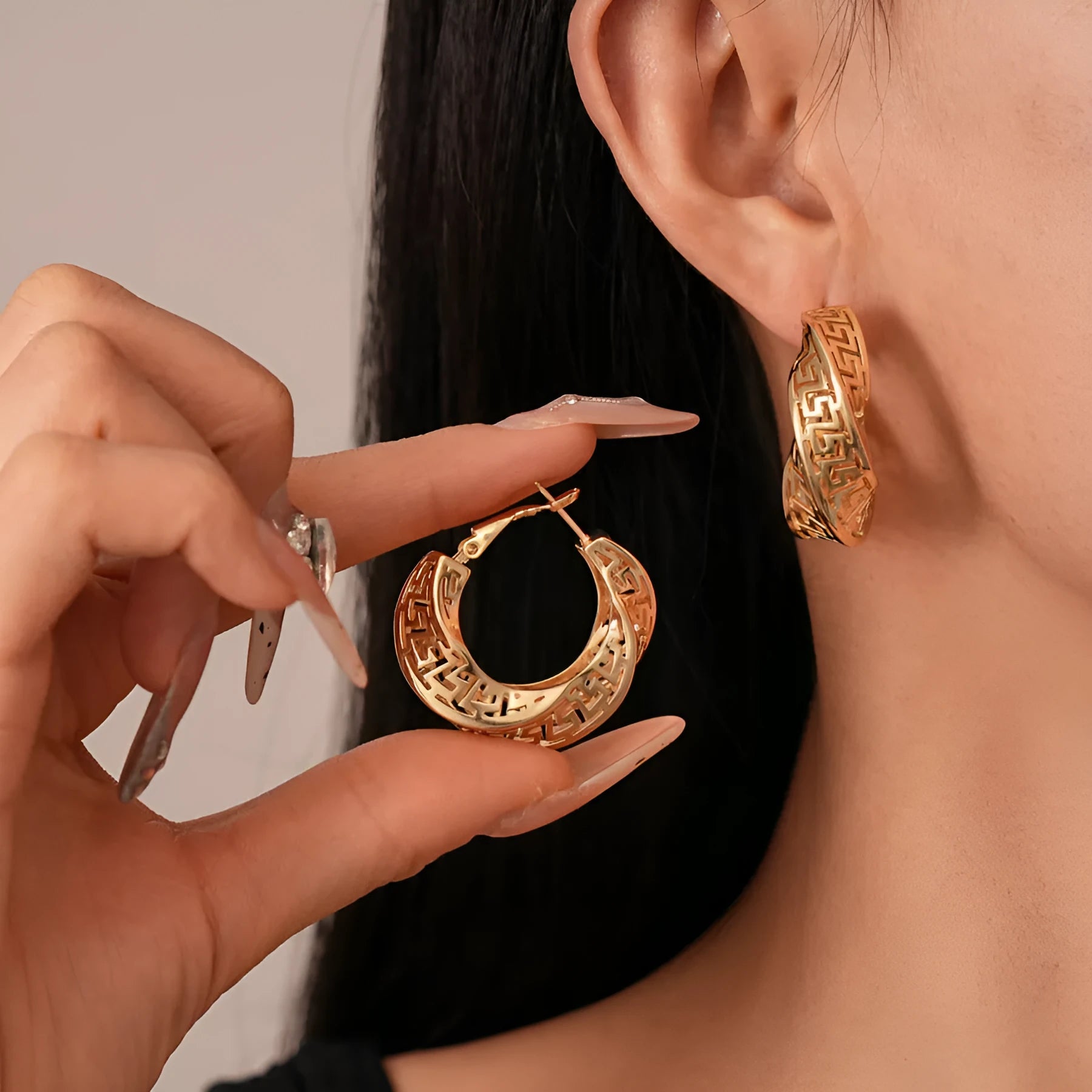 Women's geometric stud earrings with twisted round design in gold and silver electroplated copper