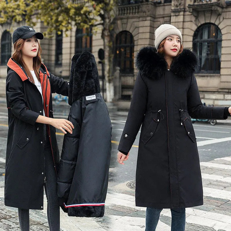 Women's long beige trench coat with a two-way zip and extended length, shown in an elegant style.