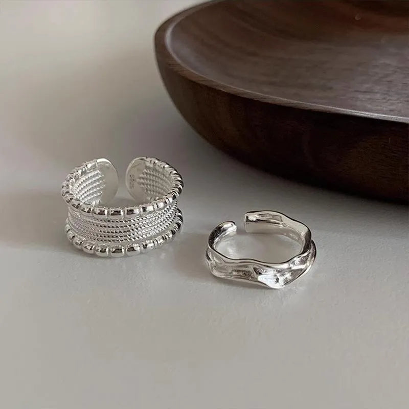Adjustable opening copper ring with woven twisted multilayer geometric design