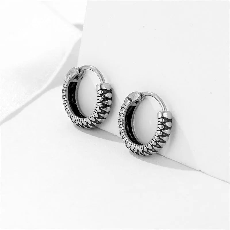Geometric silver retro twist earrings with stripe detailing on circular titanium steel hoop