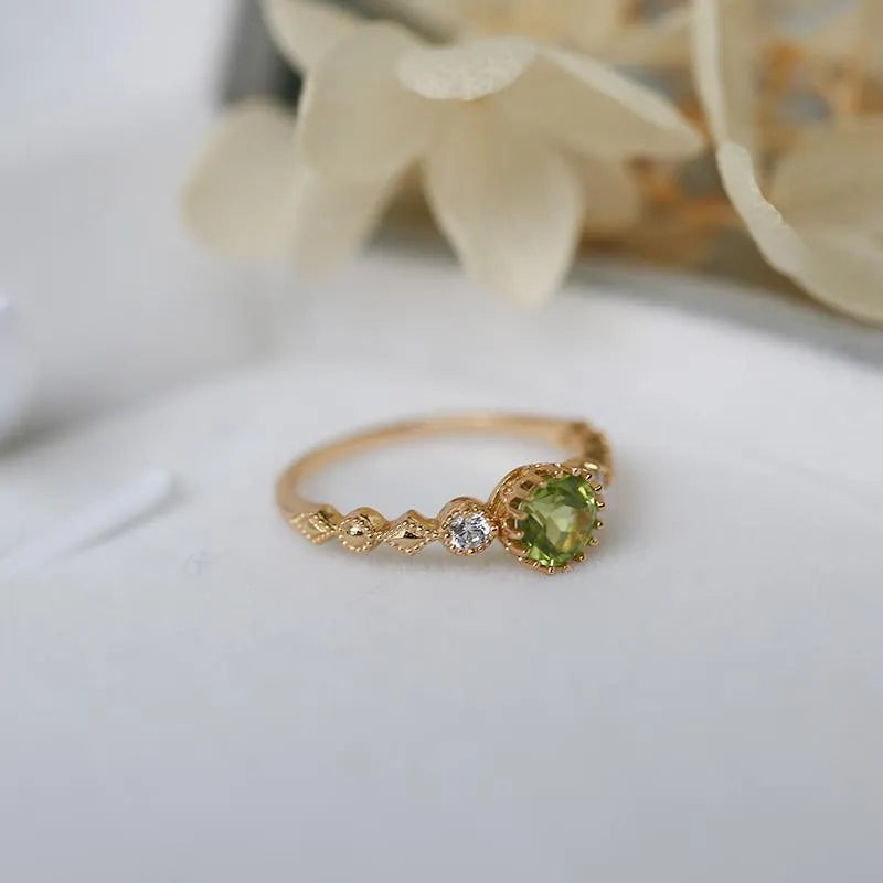 Japanese style geometric copper ring with imitation peridot centrepiece in quadrilateral design