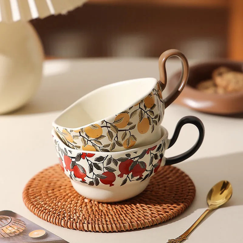 Antique style ceramic coffee cup and saucer set in black pomegranate or orange citrus retro design.