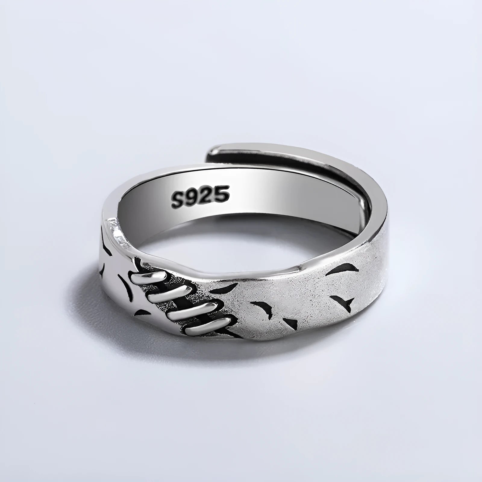 Black geometric copper women's ring with adjustable opening showing round and oval design elements