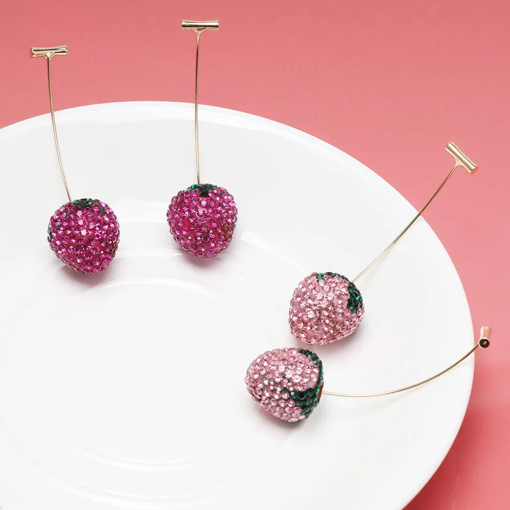 Geometric strawberry-shaped stud earrings with spot drill crystal details in red colour option