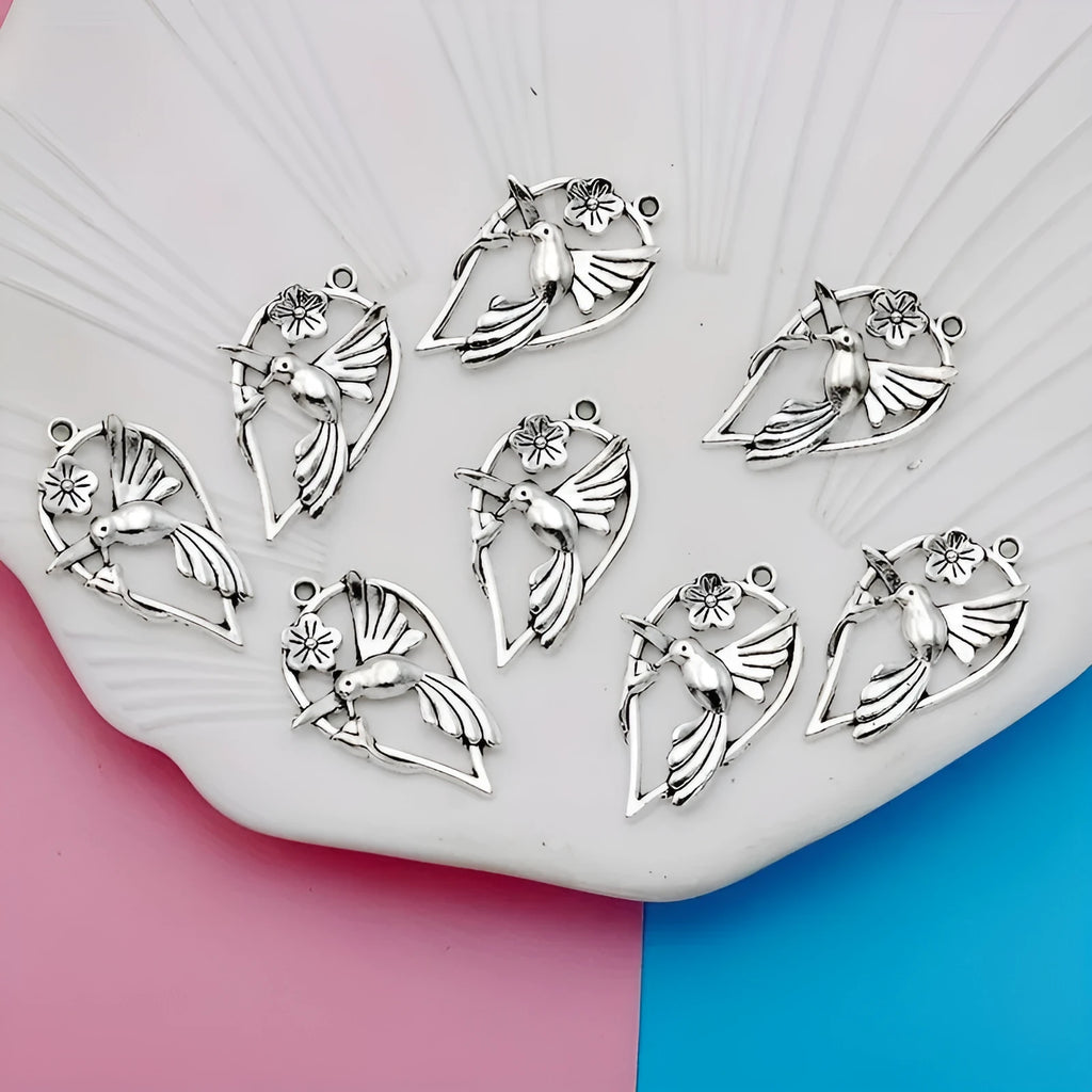 Gold-coloured alloy magpie bird charm pendant for DIY necklace or bracelet making.