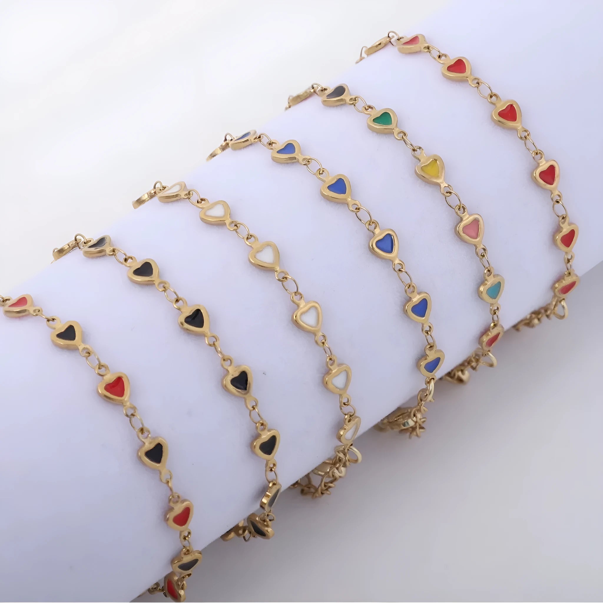 Stainless steel heart-shaped bracelet with a gold-plated finish on a wrist, showing the 17+5cm adjustable chain.