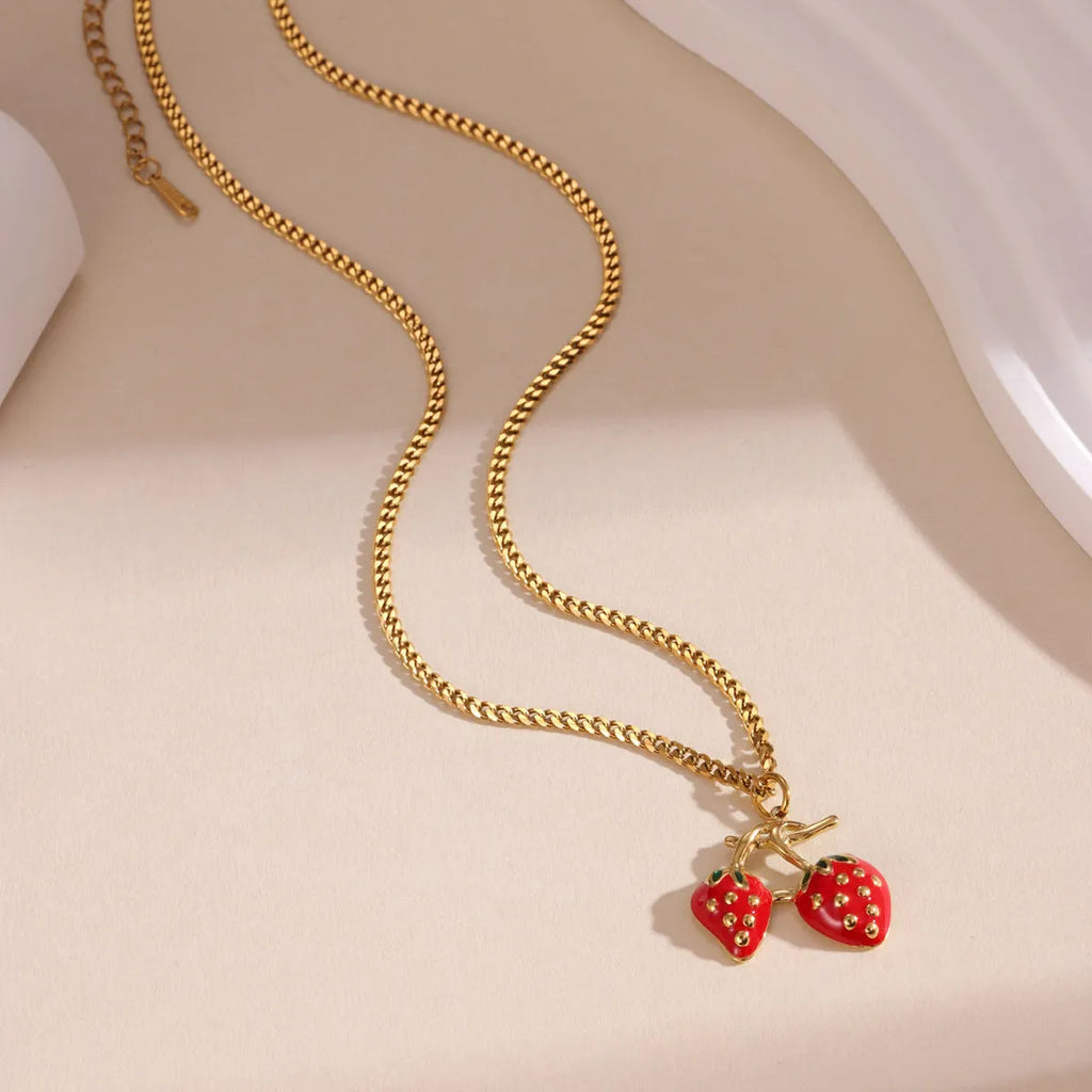 Stainless steel strawberry pendant necklace in red or white powder gradient colour options for women