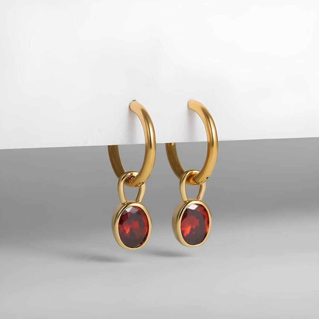 Women's oval zircon earrings in copper on a post, shown in army green colour.