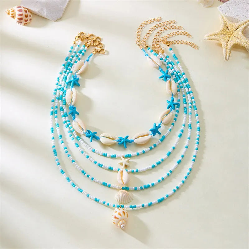 Women's starfish shell bead necklace 5-piece set with electroplated alloy pendants showing blue and mixed colour variations