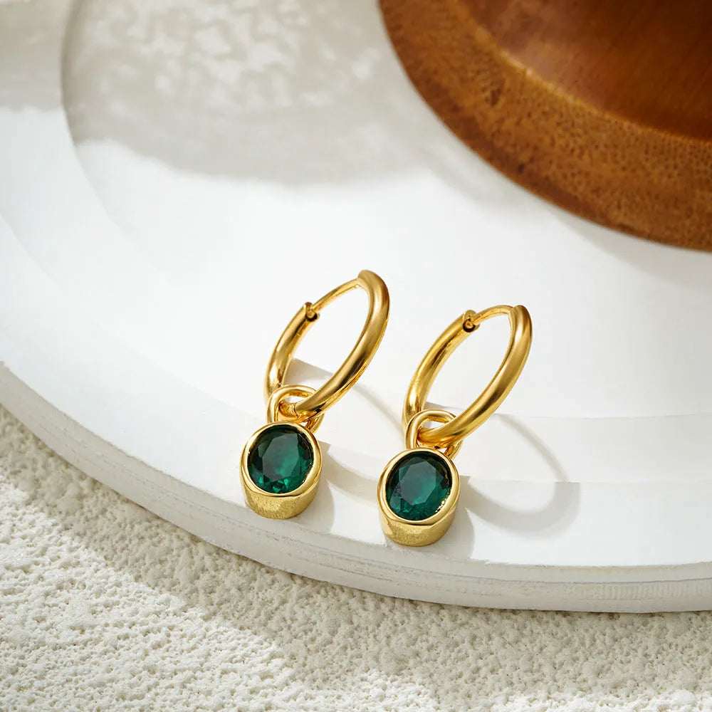 Women's oval zircon earrings in copper on a post, shown in army green colour.