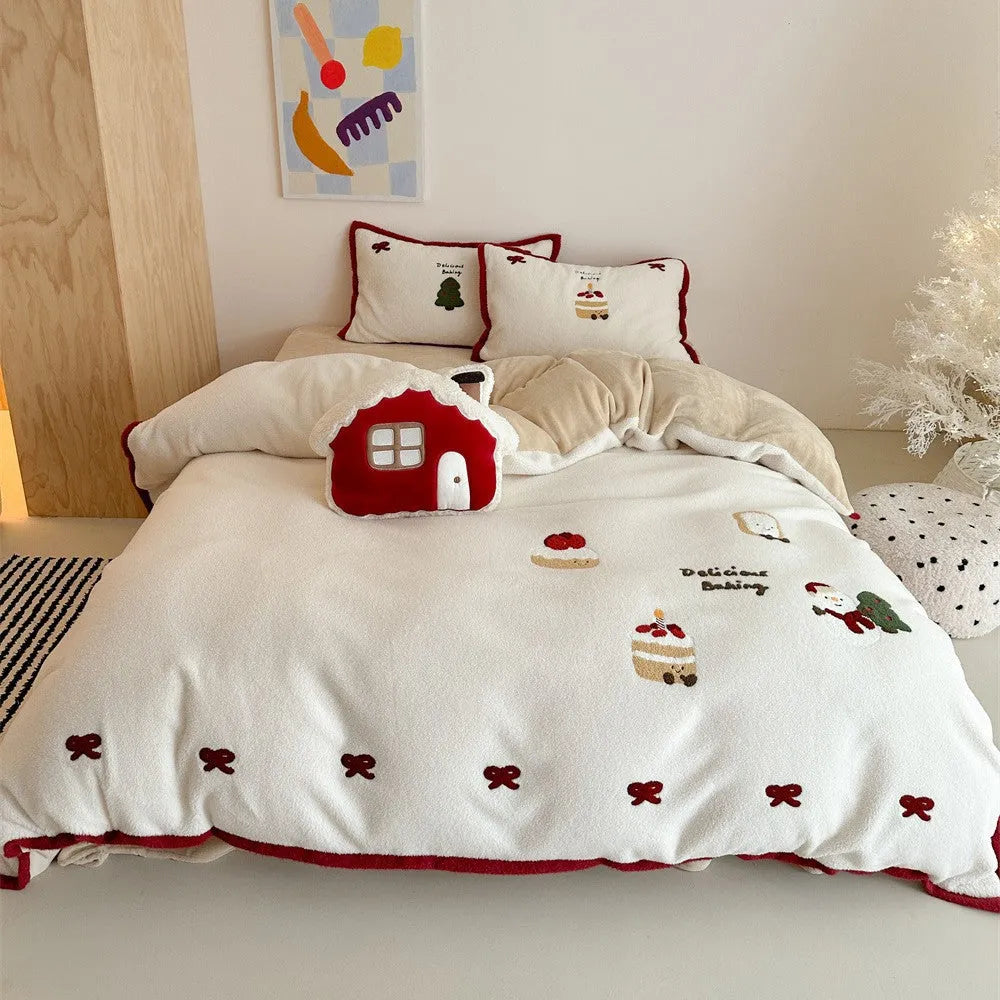 Winter Christmas cartoon patterned four-piece bedding set showing duvet cover, bed sheet, and pillowcases on a bed.