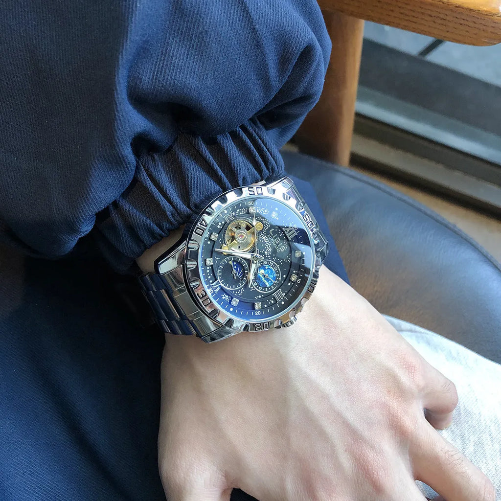 Men's silver automatic watch with black starry luminous dial and leather strap