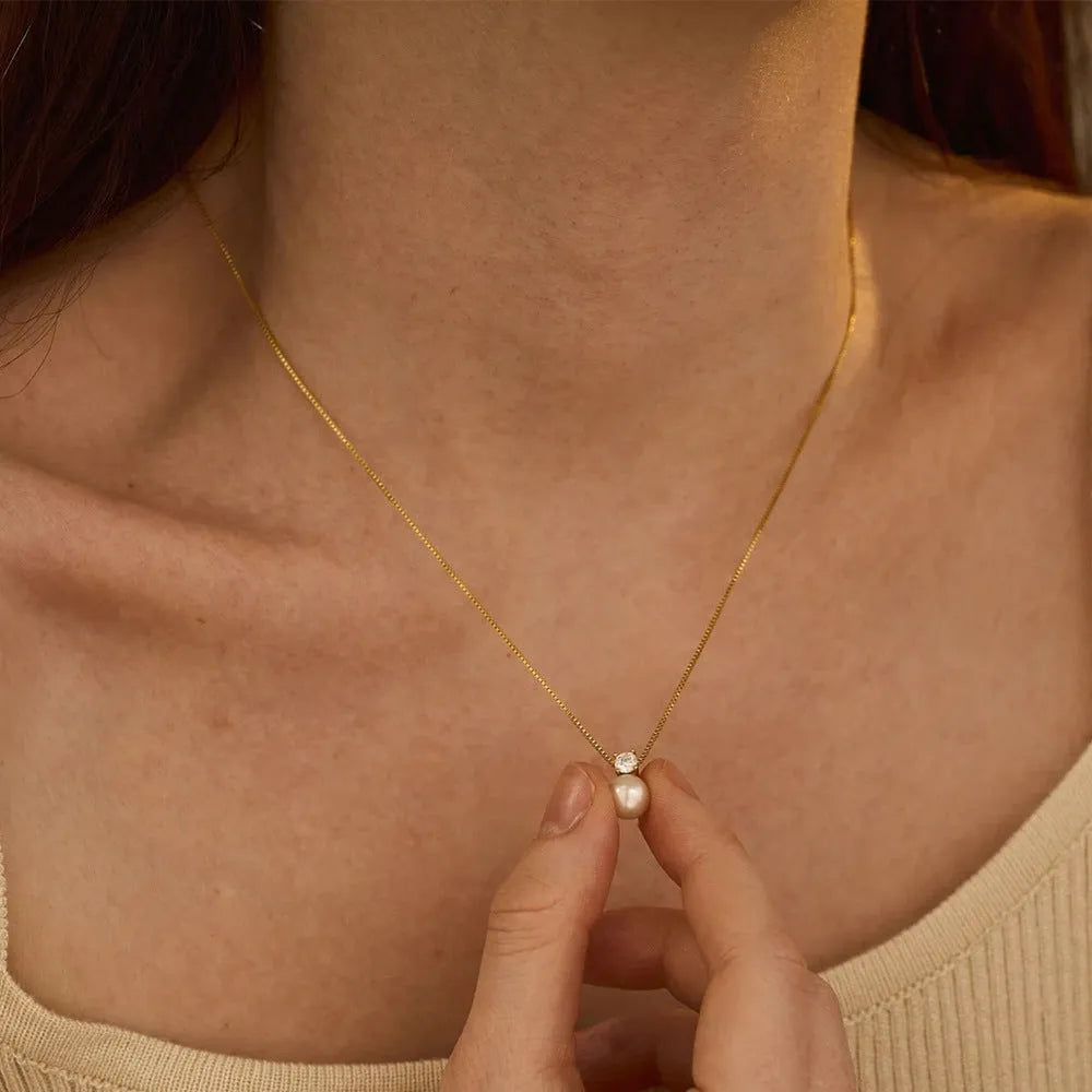 Simple stainless steel necklace with imitation pearl and zircon pendant on box chain