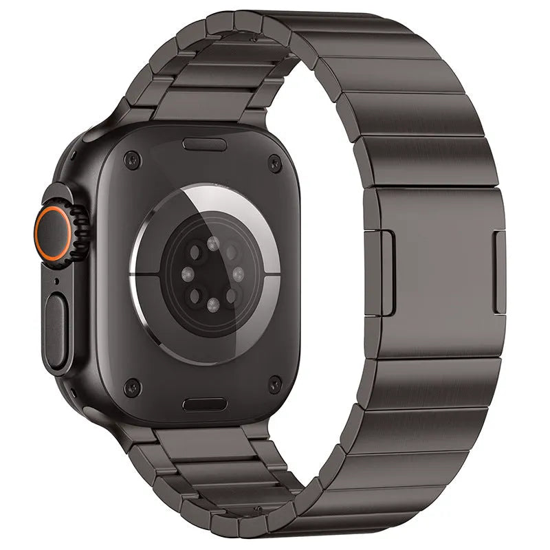 Stainless steel Apple Watch strap with magnetic fold-over buckle in silver colour.