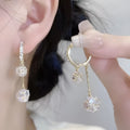 Silver colour women's earrings with tassel ball and rhinestone accents featuring confession balloon motif