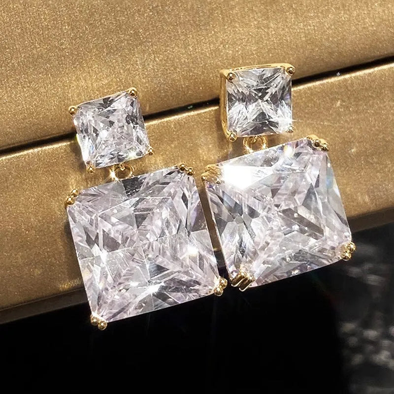 Geometric square design copper earrings with quadrilateral elements in white gold or gold colour