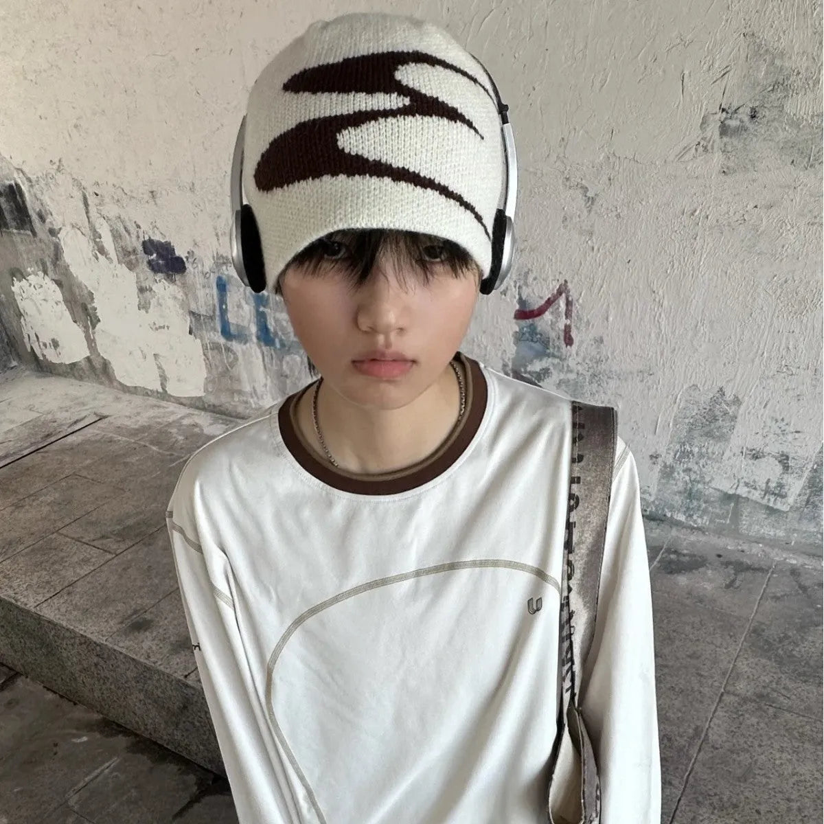 Acrylic thermal beanie hat in white colour showing woolen-style knitting texture