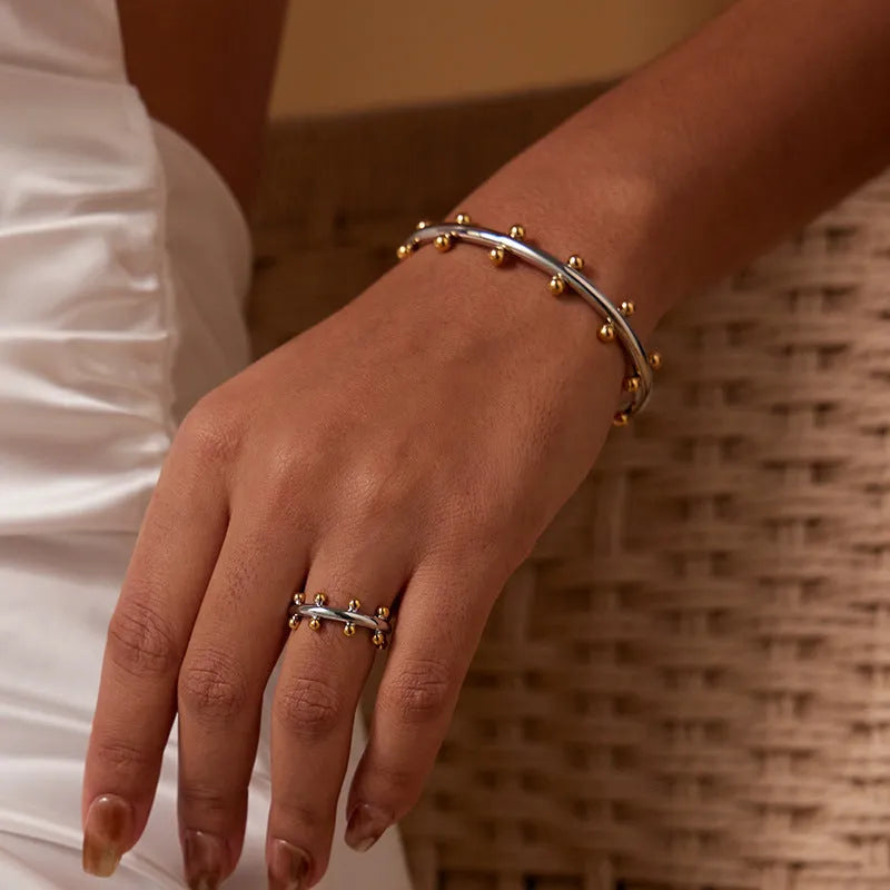 Stainless steel C-shaped bean beads with rivet texture in steel, gold and steel gold colours