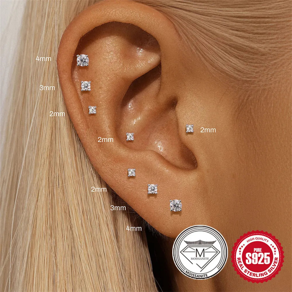 S925 sterling silver geometric petal stud earrings in platinum colour on ear.