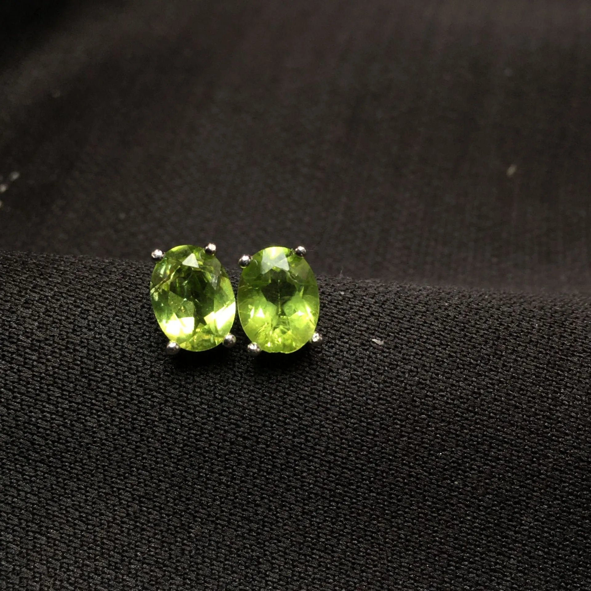 Natural olivine stud earrings in grass green set in S925 silver with 6×8mm oval faceted stone
