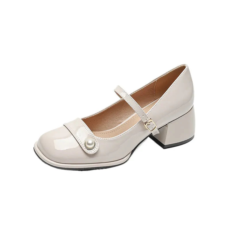 Women's apricot patent leather chunky heel pumps with a square toe and silver buckle fastening.