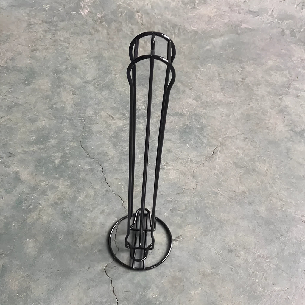Modern wrought iron coffee capsule storage rack holding pods on display shelves