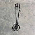 Modern wrought iron coffee capsule storage rack holding pods on display shelves