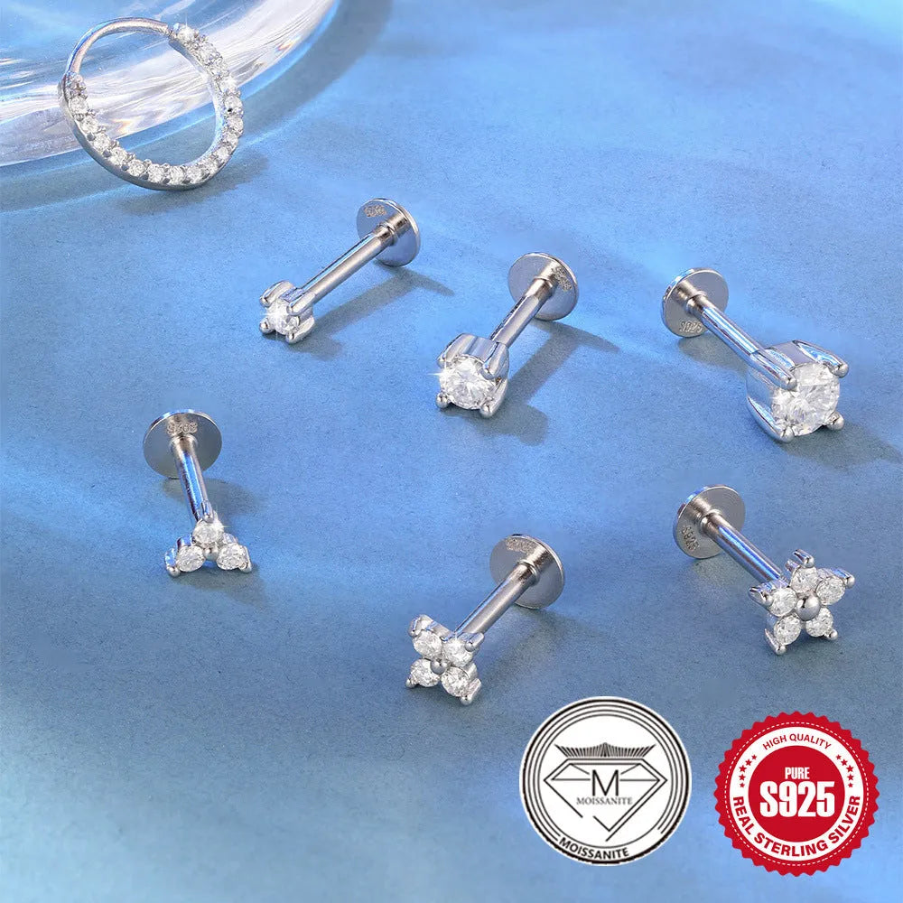 S925 sterling silver geometric petal stud earrings in platinum colour on ear.