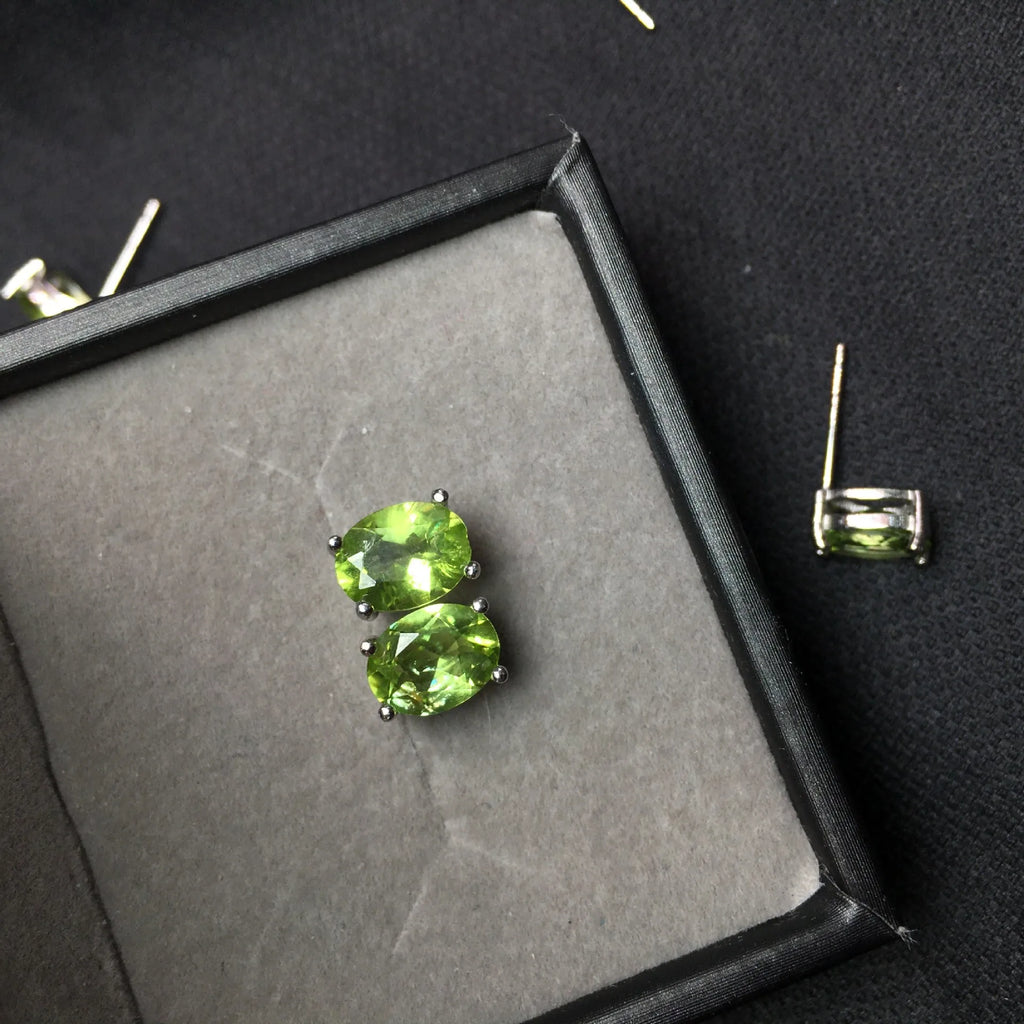 Natural olivine stud earrings in grass green set in S925 silver with 6×8mm oval faceted stone