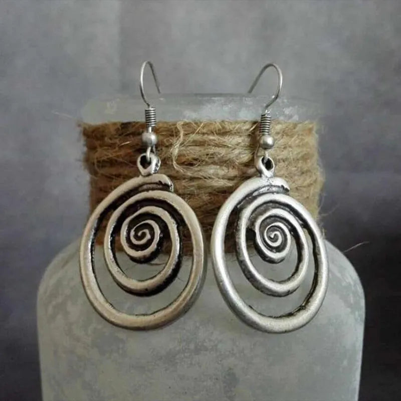 Silver geometric spiral earrings with distressed finish and national style design