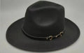 Brown leather velvet cowboy hat with a curved brim and conical crown on a neutral background.