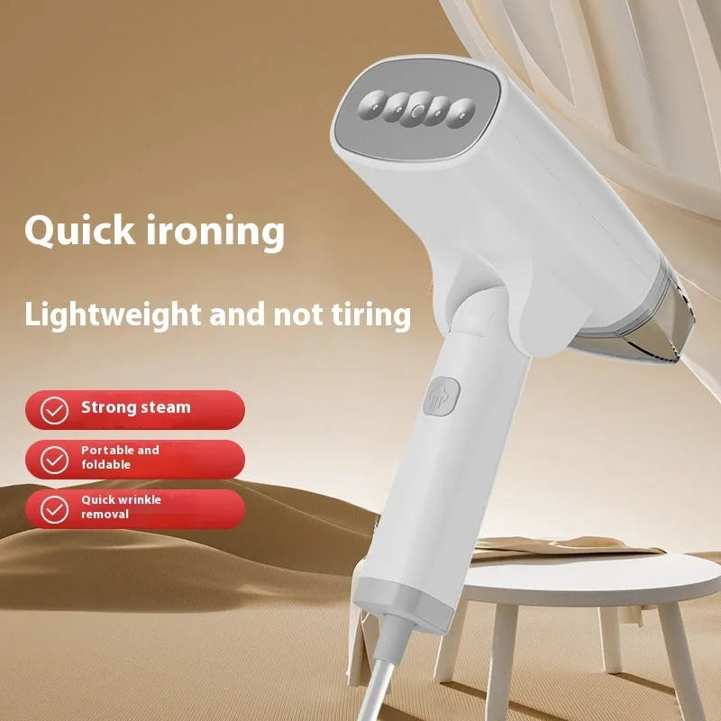 Blue handheld garment steamer with mechanical controls and water tank