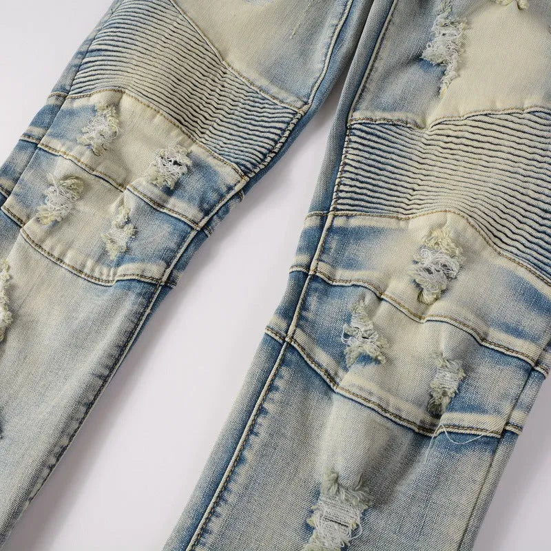Light blue men's jeans with hand-frayed distressing, slim stretch fit, and straight leg opening