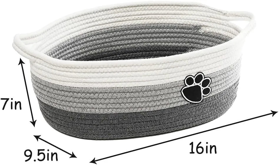 Light beige handmade cotton rope storage basket with wooden details and a handle.
