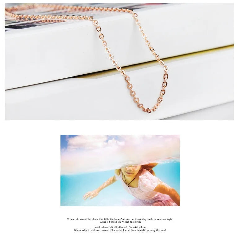 Women's heart-shaped pink synthetic crystal pendant necklace on rose gold cross chain
