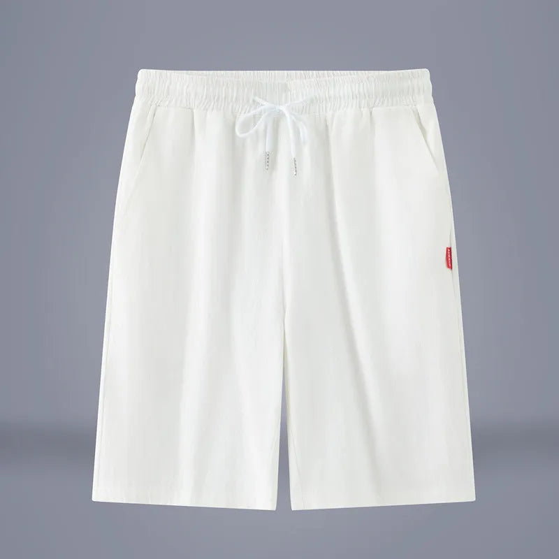 Solid colour cotton linen cropped pants with a drawstring waist on a hanger.