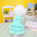 Small dog wearing princess-style dress with candy layered skirt in polyester fabric