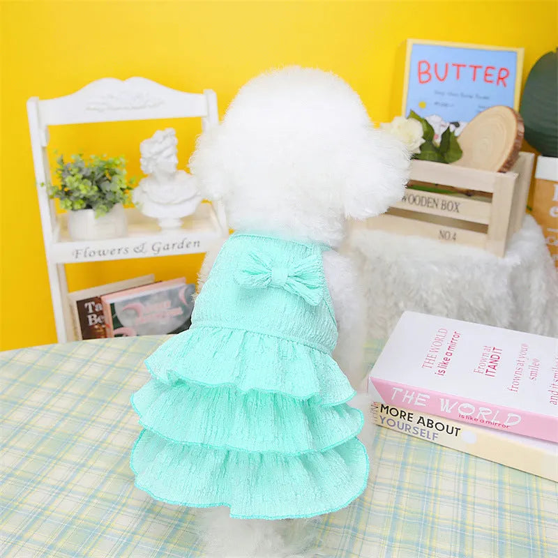 Small dog wearing princess-style dress with candy layered skirt in polyester fabric
