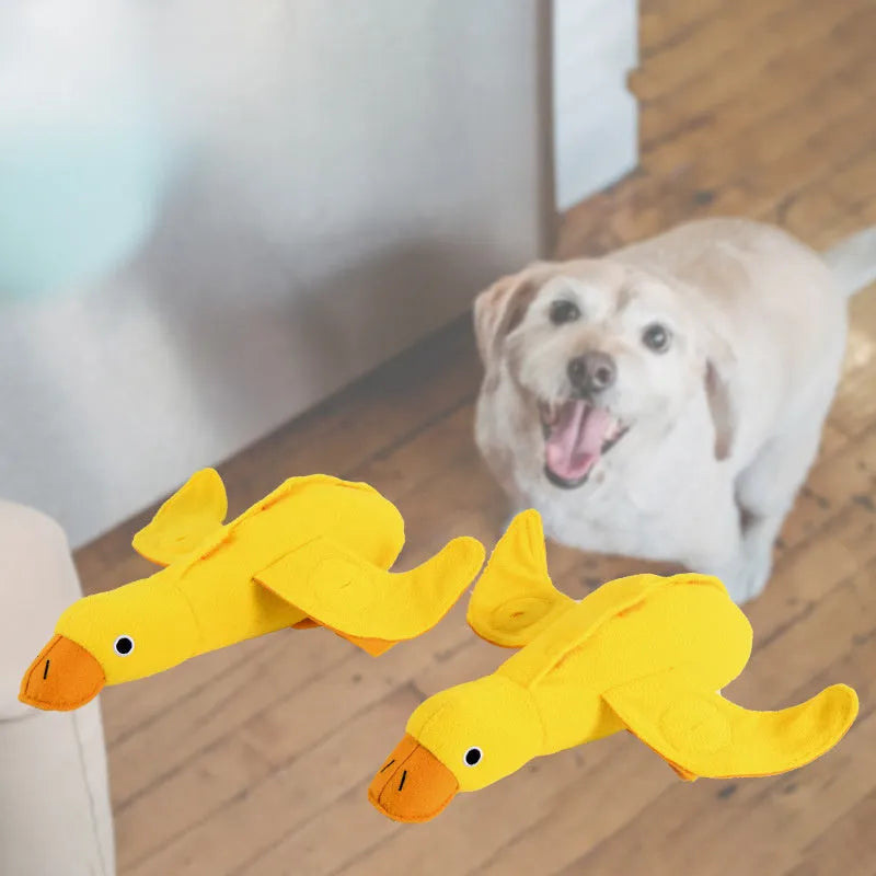 Yellow duck plush dog toy with a barking sound module for treat-dispensing play