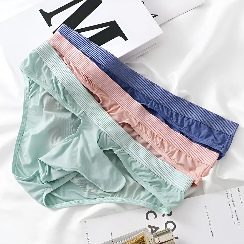 Men's low waist ice silk briefs in various colours on a white background