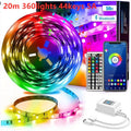 Roll of 5050 RGB LED strip light with a 44-key remote control and power adapter on a white background.